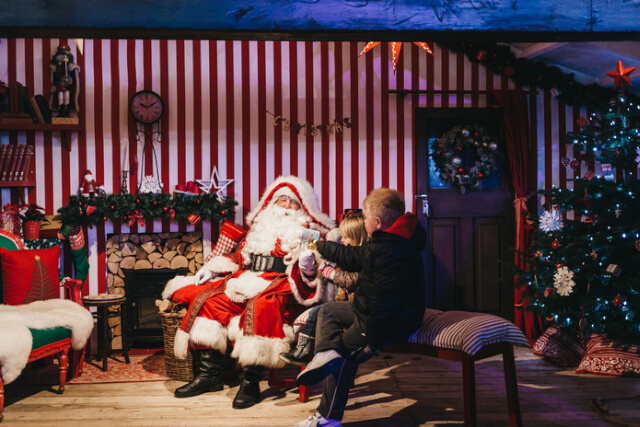 Father Christmas meeting a young boy.