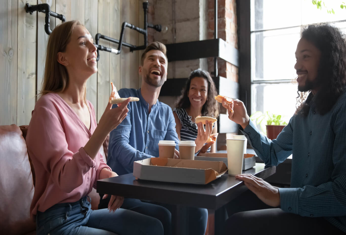 Friends eating around a table