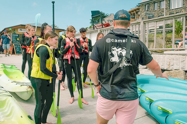 Camel Ski SUP instructor and audience.