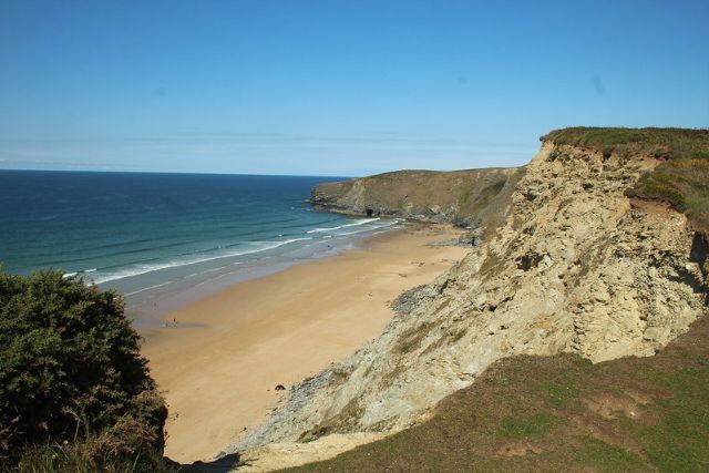 view of the beach from the cliffs above Watergate Bay